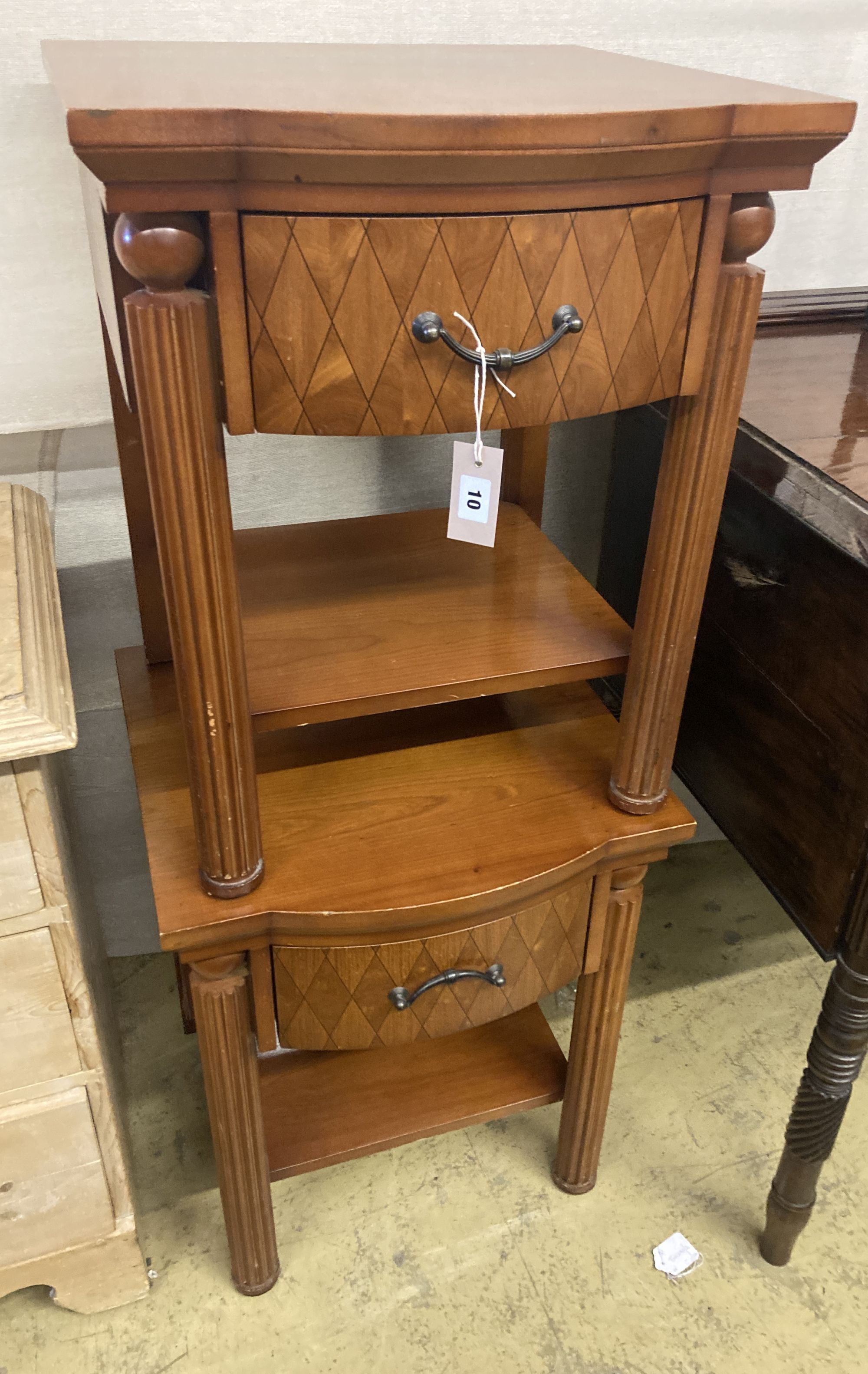 A pair of mahogany bow front bedside tables, width 50cm, depth 50cm, height 62cm